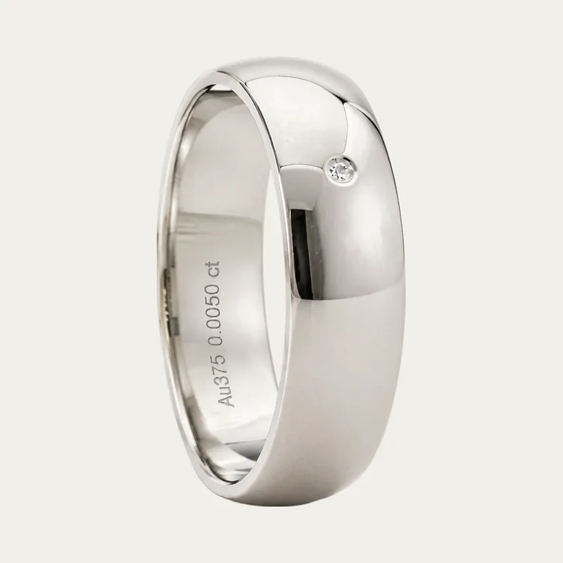 A classic platinum men's wedding ring with a flush diamond